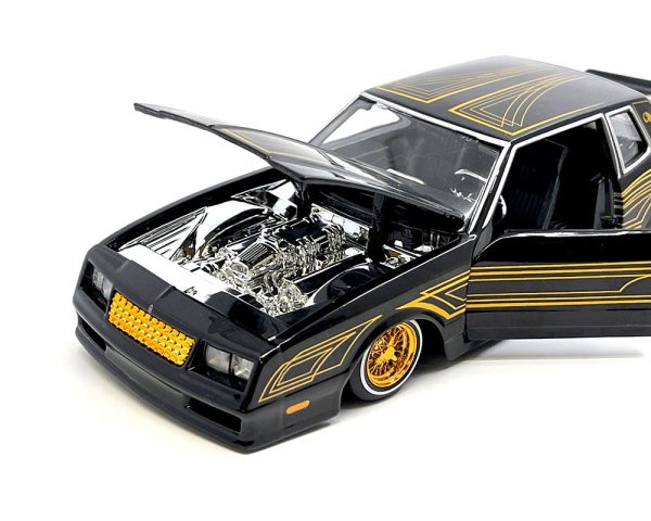 1986 Chevrolet Monte Carlo SS Lowrider Black Metallic with Gold Graphics and Wheels "Lowriders" Series 1/24 Diecast Model Car by Maisto - Image 2