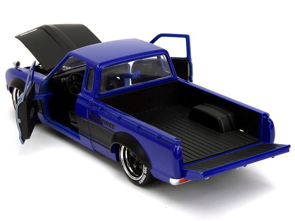 1972 Datsun 620 Pickup Truck #72 Blue Metallic with Black Stripes and Hood "Toyo Tires" with Extra Wheels "Just Trucks" Series 1/24 Diecast Model Car by Jada - Image 4