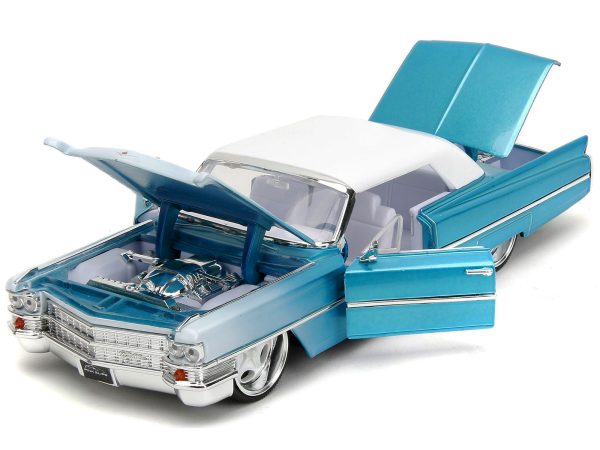 1963 Cadillac Coupe DeVille Blue Metallic and White Gradient with White Top and Interior "Pink Slips" Series 1/24 Diecast Model Car by Jada - Image 5