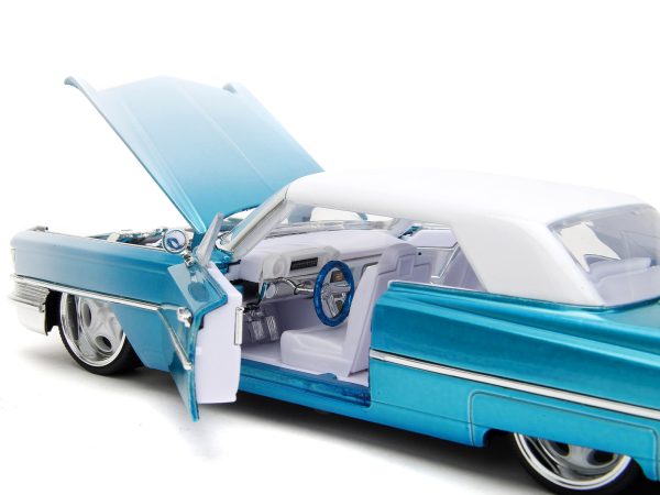 1963 Cadillac Coupe DeVille Blue Metallic and White Gradient with White Top and Interior "Pink Slips" Series 1/24 Diecast Model Car by Jada - Image 2