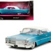 1963 Cadillac Coupe DeVille Blue Metallic and White Gradient with White Top and Interior "Pink Slips" Series 1/24 Diecast Model Car by Jada