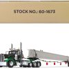 Peterbilt 389 Day Cab and ERMC 4-Axle Hydra-Steer Trailer with Bridge Beam Section Load Black and Green 1/64 Diecast Model by DCP/First Gear