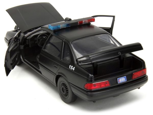 Ford Taurus OCP Matt Black "Detroit Police" and Robocop Diecast Figure 35th Anniversary "Robocop" (1987) Movie "Hollywood Rides" Series 1/24 Diecast Model Car by Jada - Image 4