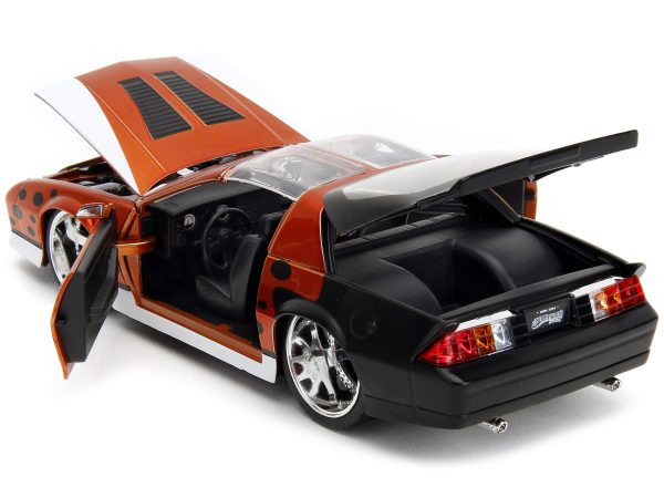 1985 Chevrolet Camaro Z/28 Orange Metallic with Graphics and Chester Cheetah Diecast Figure "Cheetos" "Hollywood Rides" Series 1/24 Diecast Model Car by Jada - Image 2